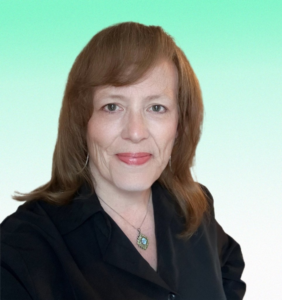 Headshot of Heather Davis--smiling white woman with dark blonde hair to shoulders wearing black shirt in front of light green background.